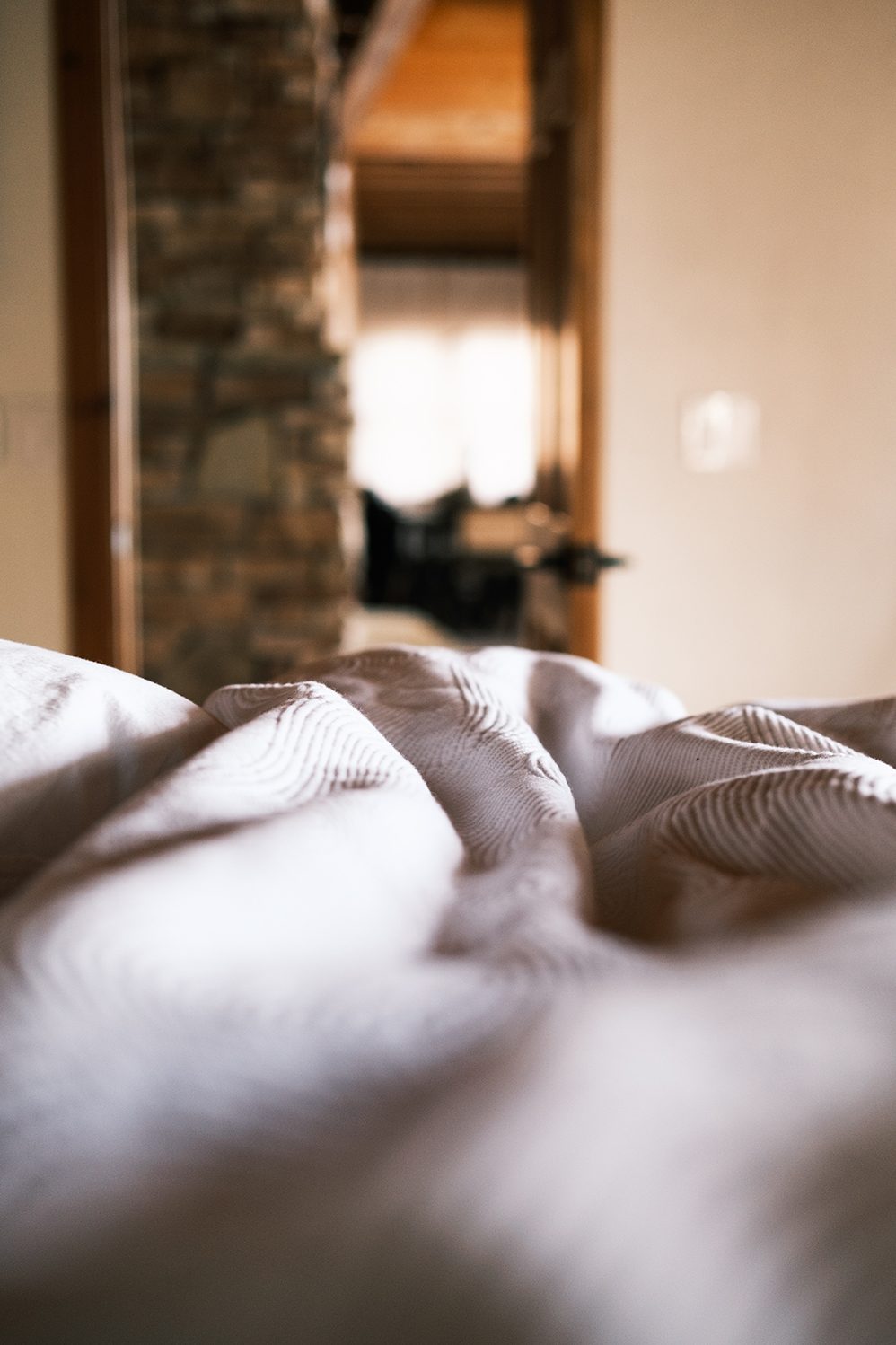 Soft rumpled linens in morning light