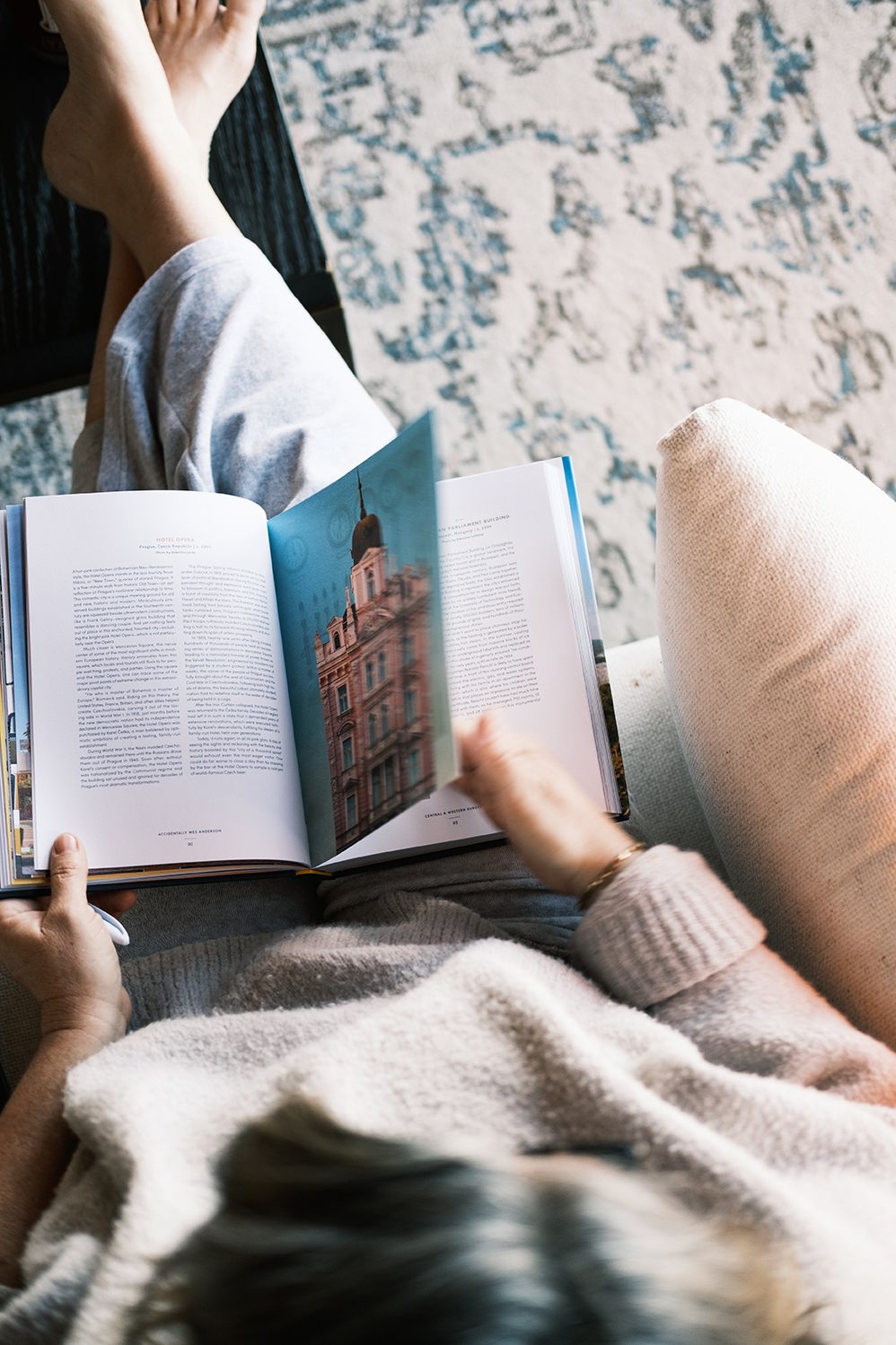 Deep in a book by the window