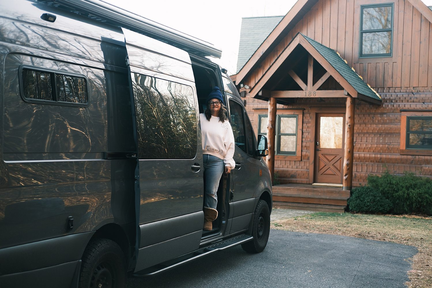The van packed and parked in front of the cabin, time to leave